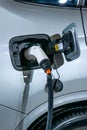 Electric vehicles and electric vehicle charging stations