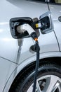 Electric vehicles and electric vehicle charging stations