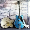 Electric Vintage Guitars against a Musical Backdrop Royalty Free Stock Photo