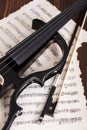 Electric violin detail with score Royalty Free Stock Photo