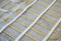 Electric warm floor laying. Cable and fiberglass mesh Royalty Free Stock Photo