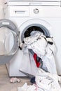 Electric washer with clothes inside in the laundry room Royalty Free Stock Photo