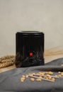 Electric wax heater with closed lid. Heating process of wax droplets