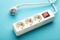 Electric white portable socket on blue background Royalty Free Stock Photo