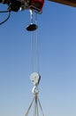 electric winch hook lifts load on cables at the construction site
