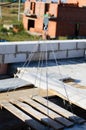 electric winch hook lifts load on cables at the construction site