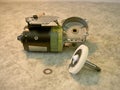 Electric wiper motor disassembled, with plastic wheel, oblique view