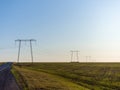 Electric wire pylons stand on the garrison Royalty Free Stock Photo