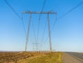 Electric wire supports in perspective Royalty Free Stock Photo