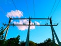 Electric wires on a support in a blue sky Royalty Free Stock Photo