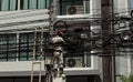 Electric.Working man repairs an electrical malfunction in the wiring. Thailand Bangkok