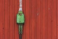 Electrical box on a wooden red background, poweroutlet in green Royalty Free Stock Photo