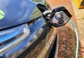 Electrical Car plugged in at a Charging Point