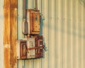 The electrical circuit box that is old and rusty was installed next to the wall of the factory Royalty Free Stock Photo