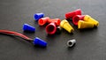 Electrical colorful wire connectors on black background Royalty Free Stock Photo