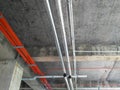 Electrical conduit, cable tray and aircond pipes as part of services above ceiling installed at the construction.