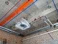 Electrical conduit, cable tray and aircond pipes as part of services above ceiling installed at the construction.