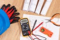 Electrical drawings, multimeter for measurement in electrical installation and accessories for engineer jobs Royalty Free Stock Photo