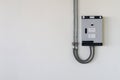 Electrical control box with cable tube on the wall