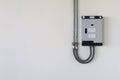 Electrical control box with cable tube on the wall Royalty Free Stock Photo