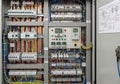 Electrical control panel with neatly organized circuit breakers and multicolored wires. Three Royalty Free Stock Photo