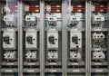 Electrical control panel with various circuit breakers, relays, and switches neatly arranged inside Royalty Free Stock Photo