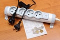 Electrical cords disconnected from power strip, electricity bill Royalty Free Stock Photo