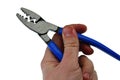 Electrical Crimping stripping pliers with blue rubber handle held in left hand of adult male person, opened jaws, white background