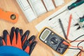 Electrical diagrams, multimeter for measurement in electrical installation and accessories for use in engineer jobs Royalty Free Stock Photo