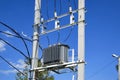 An electrical distribution transformer with cooling