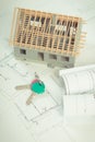 Electrical drawings, home keys and small house under construction, concept of building home Royalty Free Stock Photo