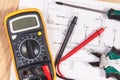 Electrical drawings, multimeter for measurement in electrical installation and accessories for use in engineer jobs Royalty Free Stock Photo