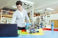 Electrical engineer programming a robot during robotics class Royalty Free Stock Photo