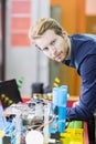 Electrical engineer programming a robot during robotics class Royalty Free Stock Photo