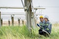 Electrical engineer on solar farm with large structure Check maintain rehearse damaged parts from use in order to produce