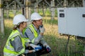 Electrical engineer on solar farm with large structure Check maintain rehearse damaged parts from use in order to produce