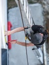 an electrical engineer of the team installs the electrical cables for the autonomous photovoltaic solar panel system. It is