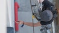 an electrical engineer of the team installs the electrical cables for the autonomous photovoltaic solar panel system. It is