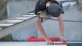 an electrical engineer of the team installs the electrical cables for the autonomous photovoltaic solar panel system. It is