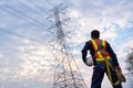 An electrical engineer or technician wear fall arrestor device for worker with hooks for safety body harness. Working at height Royalty Free Stock Photo