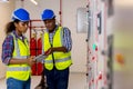 Electrical engineer working in control room. Electrical engineer man checking Power Distribution Cabinet in the control room Royalty Free Stock Photo