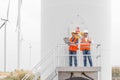 Electrical engineers and technician working in wind turbine