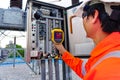 Electrical engineers used a thermometer to check for faults in equipment sets, Also known as preventive maintenance to reduce the