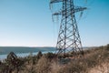 Electrical equipment, high voltage power line insulators on winter sky backdrop. Royalty Free Stock Photo