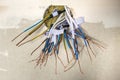 Electrical exposed connected wires protruding from socket on white wall. Electrical wiring installation. Finishing works in