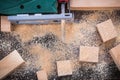 Electrical fretsaw sawdust and wooden planks on vintage wood bac