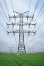 Electrical grid. A lot of high-voltage power line, transmission tower overhead line masts, high voltage pylons as power pylons Royalty Free Stock Photo