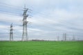 Electrical grid. A lot of high-voltage power line, transmission tower overhead line masts, high voltage pylons as power pylons Royalty Free Stock Photo