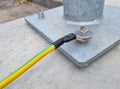 electrical grounding or earthing wire at a zinc-plated steel pole