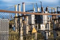 Warning signs of electrical hazard on fence